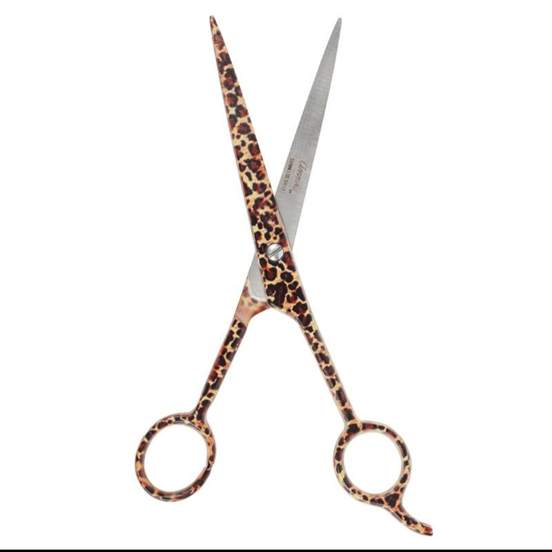 Leopard print scissors with silver metal blades, shown crossed against a plain white background.