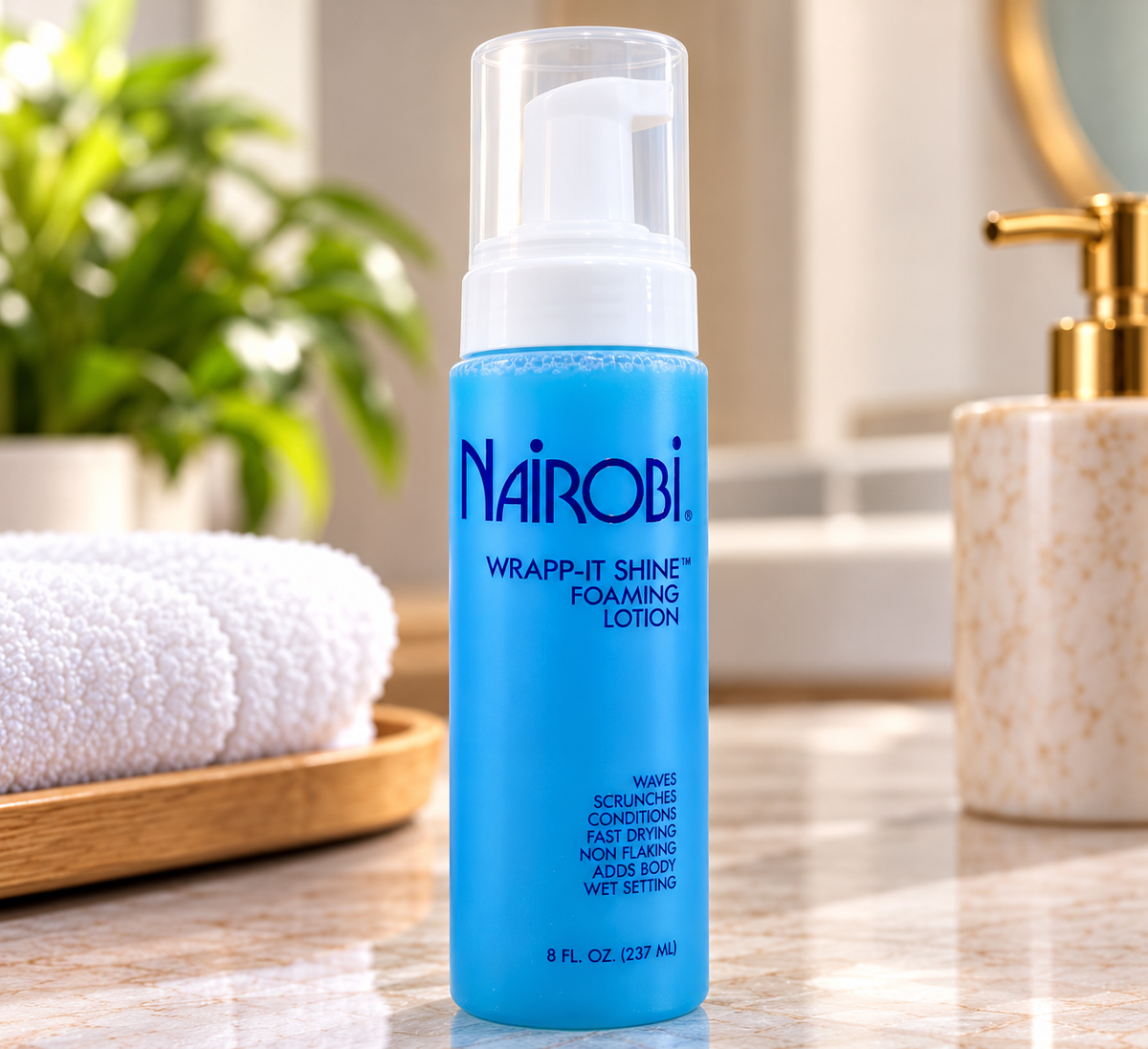 A bottle of Nairobi Wrap-It Shine Foaming Lotion. 237ml