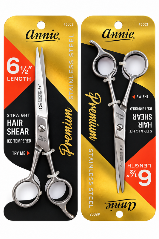 Two Annie's 6 1/2 inch straight hair shears in stainless steel, each in its original retail blister packaging. The packaging features a bold yellow and black design with red accents and white text detailing the product features.